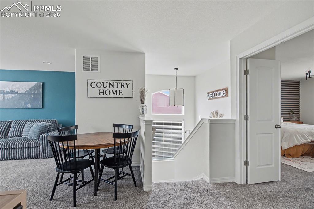 7811 Berwyn Loop Peyton, CO 80831 - Photo 21 of 38 a view of a dining room with furniture
