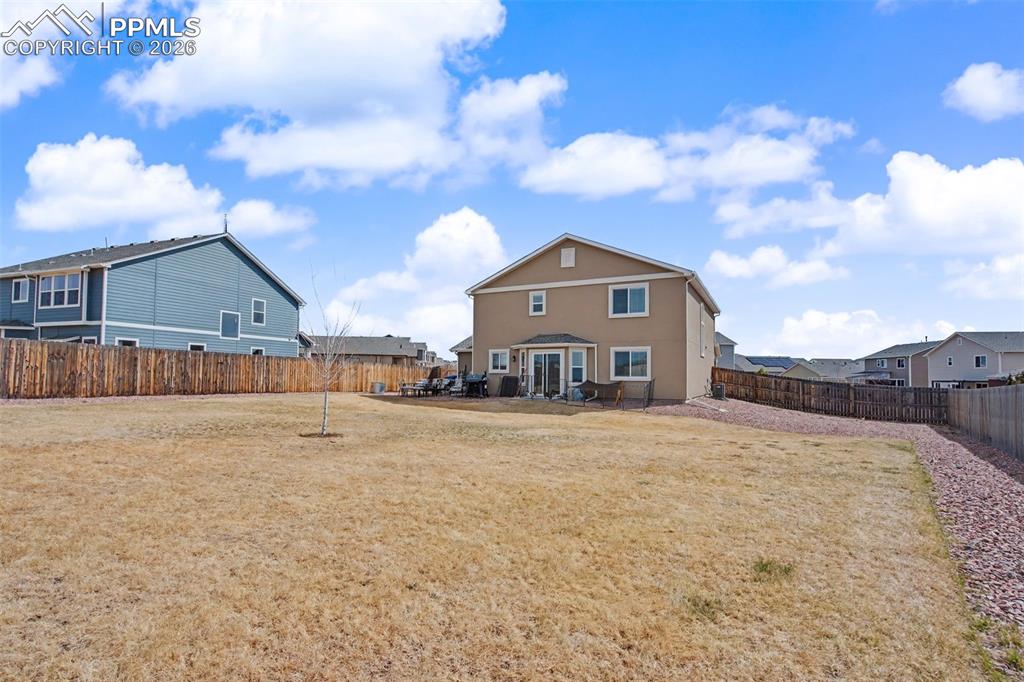 7811 Berwyn Loop Peyton, CO 80831 - Photo 38 of 38 a view of a house with a yard