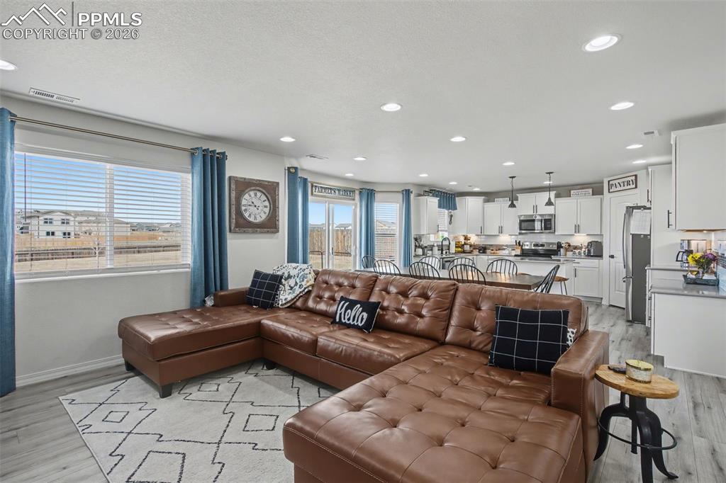 7811 Berwyn Loop Peyton, CO 80831 - Photo 4 of 38 a living room with furniture and a large window