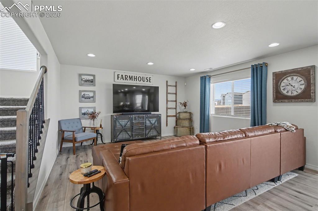 7811 Berwyn Loop Peyton, CO 80831 - Photo 8 of 38 a living room with furniture and a flat screen tv