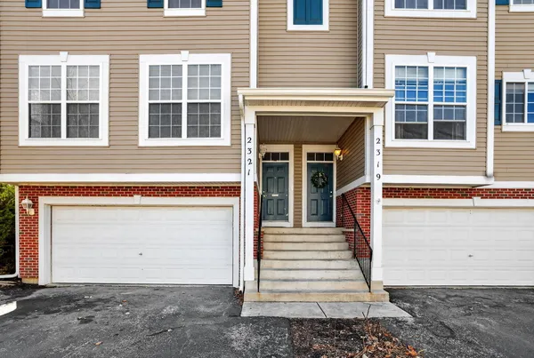 a front view of a house with a garage