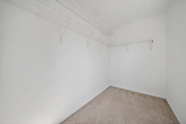 an empty room with fan and a ceiling fan