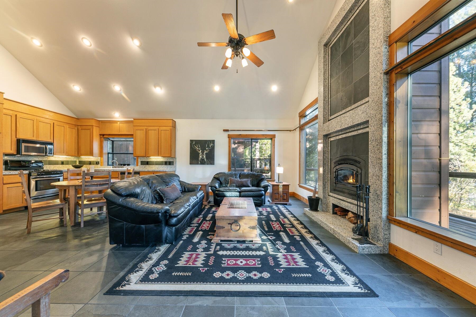 14580 Donner Pass Road Truckee, CA 96161 - Photo 11 of 27 a living room with furniture fireplace and a table
