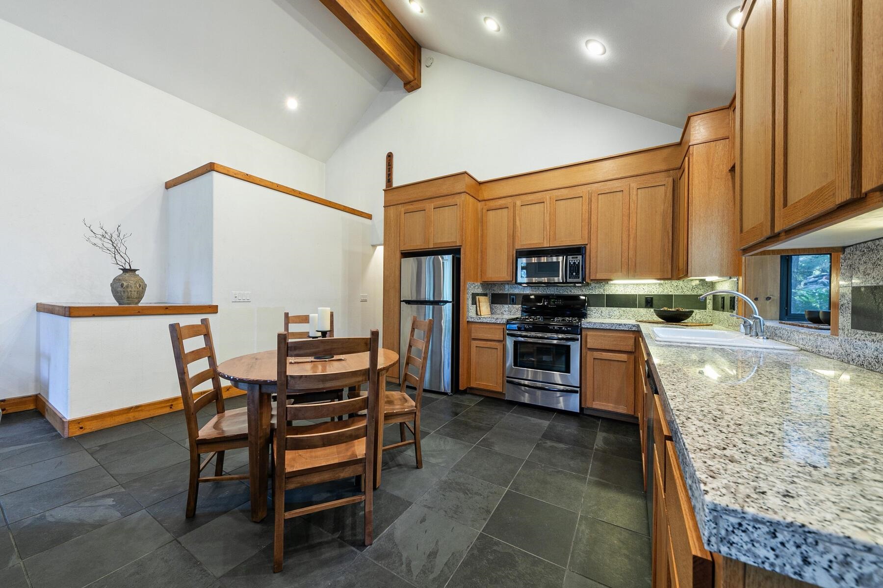 14580 Donner Pass Road Truckee, CA 96161 - Photo 12 of 27 a kitchen with a stove a sink and a refrigerator