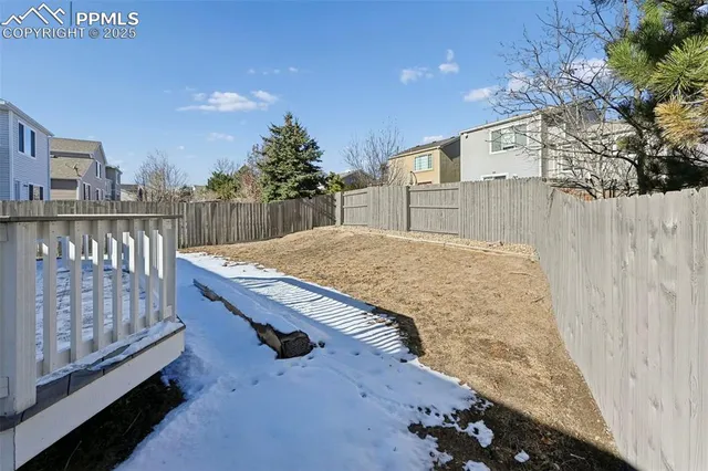 a view of balcony with wooden floor and fence