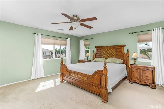 a bed sitting in a room next to a window