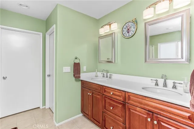 a spacious bathroom with a sink and a mirror