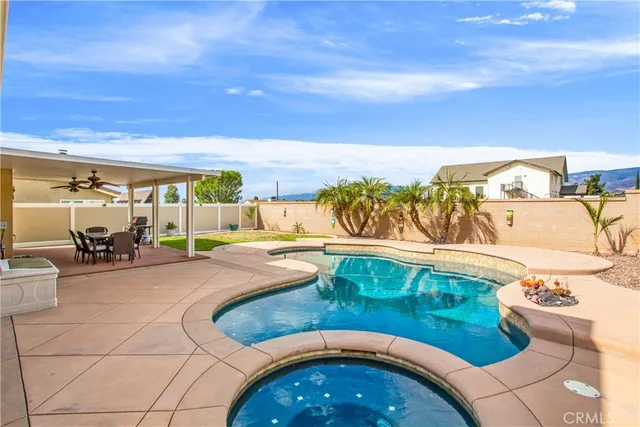 a view of swimming pool with furniture