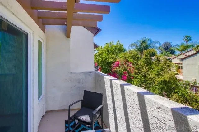a view of a swimming pool with a lounge chairs