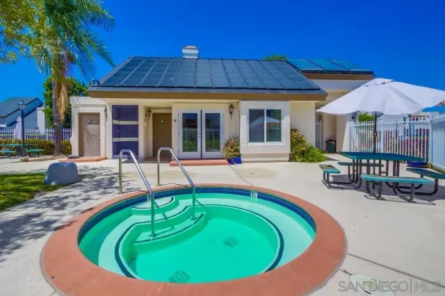 a view of a garden with a house