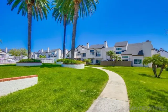 a front view of house with yard and swimming pool