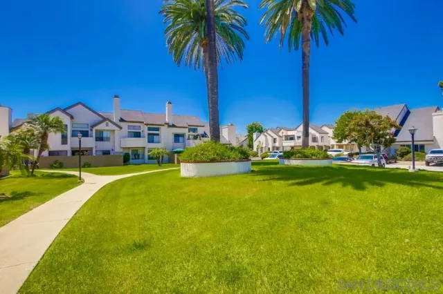 a car parked in front of a white building