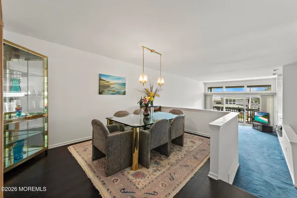 a living room with hard wood floors and a window