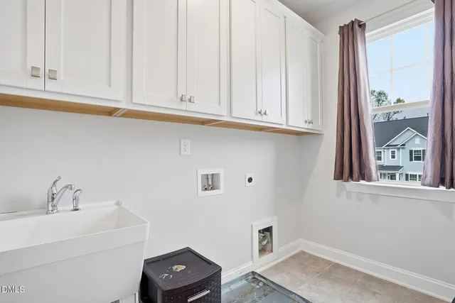 a bathroom with a sink and cabinets