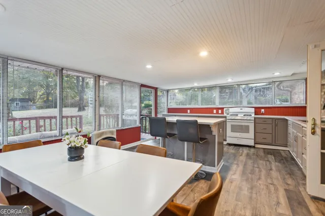 a view of a dining room with furniture and window