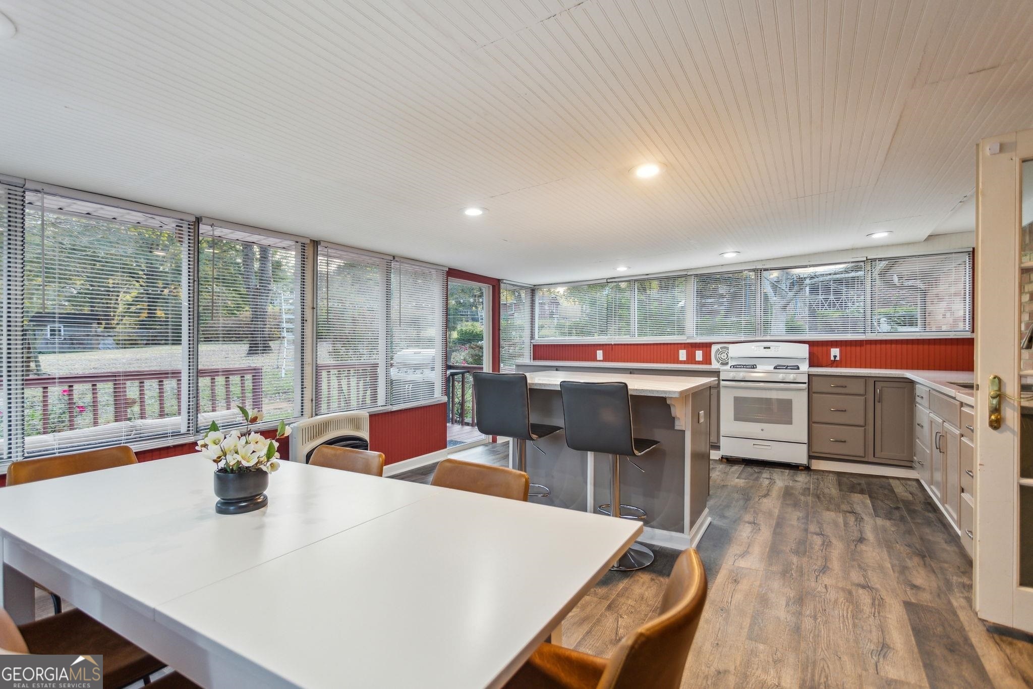 425 Plantation Road Southwest Smyrna, GA 30082 - Photo 13 of 42 a large white kitchen with a large window