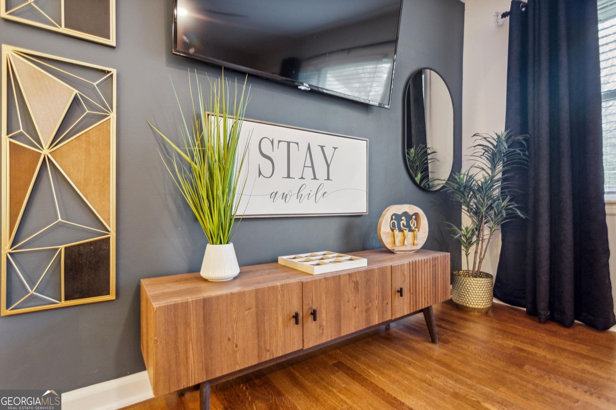 425 Plantation Road Southwest Smyrna, GA 30082 - Photo 2 of 42 a view of a dresser and couch in a hallway