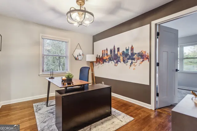 a bedroom with a bed and wall painting