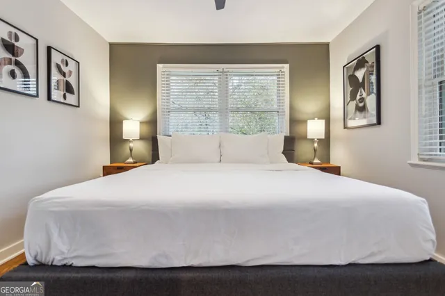 a bathroom with a sink toilet and mirror