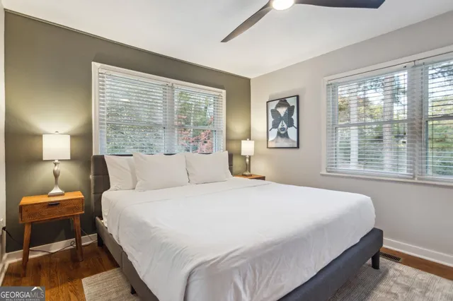 a bedroom with a bed and window