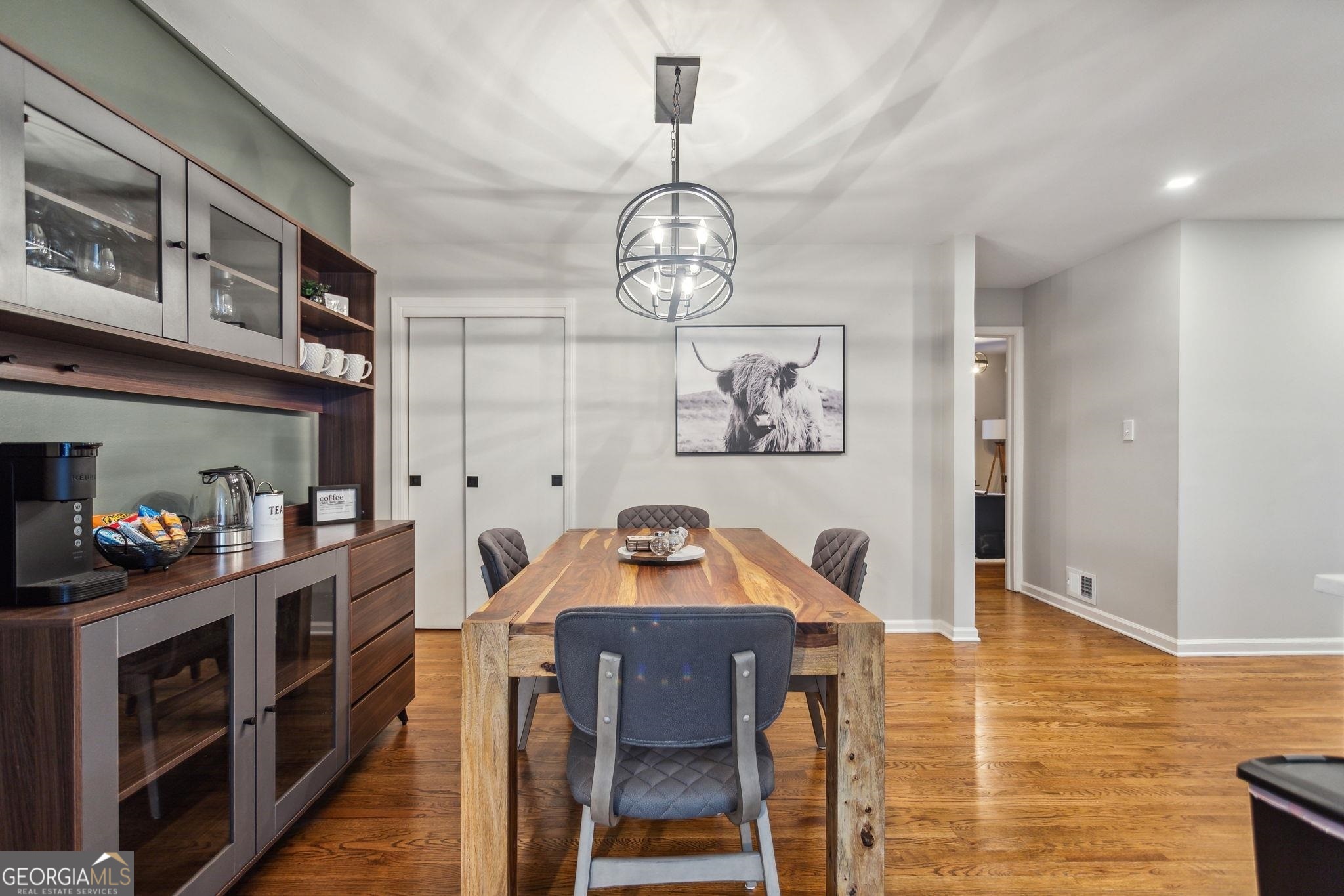 425 Plantation Road Southwest Smyrna, GA 30082 - Photo 7 of 42 a view of a room with wooden floor and furniture