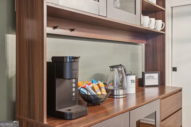 a kitchen with a refrigerator and cabinets