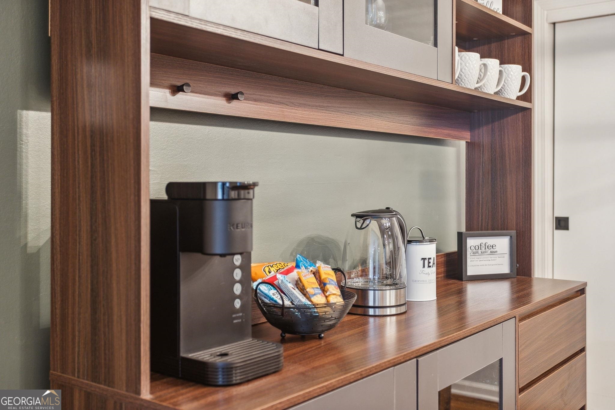 425 Plantation Road Southwest Smyrna, GA 30082 - Photo 8 of 42 a kitchen with a refrigerator and cabinets