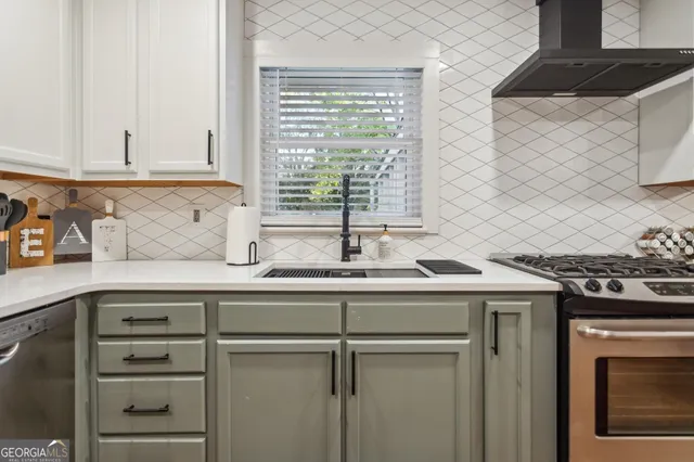 a kitchen with a sink and cabinets