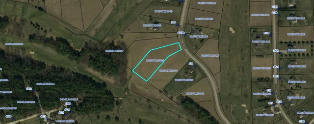 an aerial view of a residential apartment building with a yard