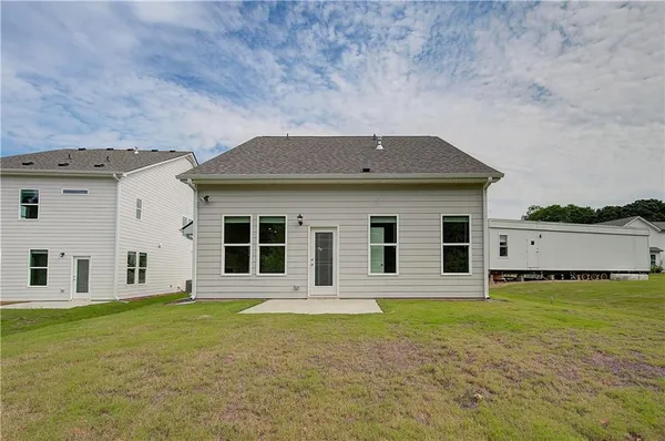 a house with swimming pool in front of it
