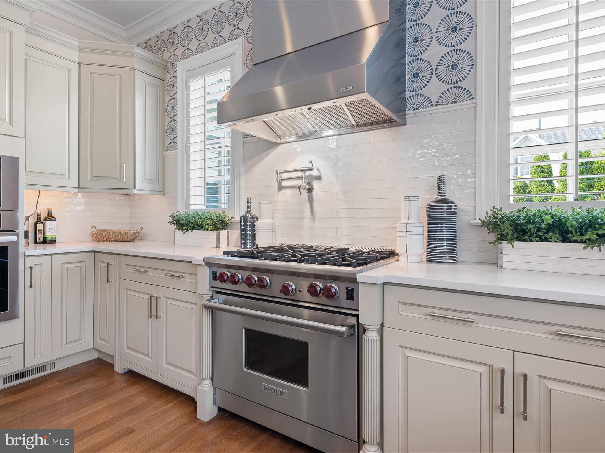 2 A Courtney Road Wilmington, DE 19807 - Photo 23 of 52 a kitchen with stainless steel appliances white cabinets and a stove