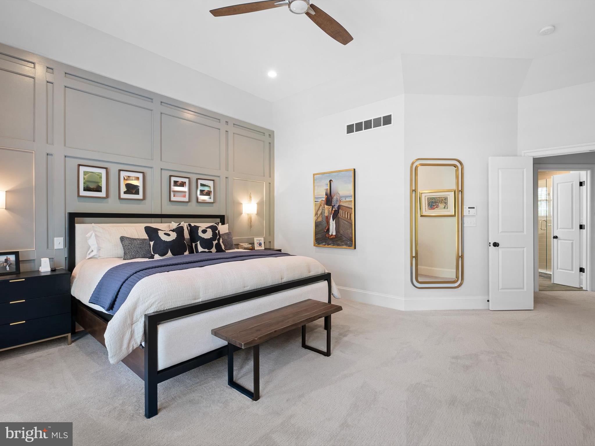 2 A Courtney Road Wilmington, DE 19807 - Photo 27 of 52 a spacious bedroom with a bed and painting on the wall