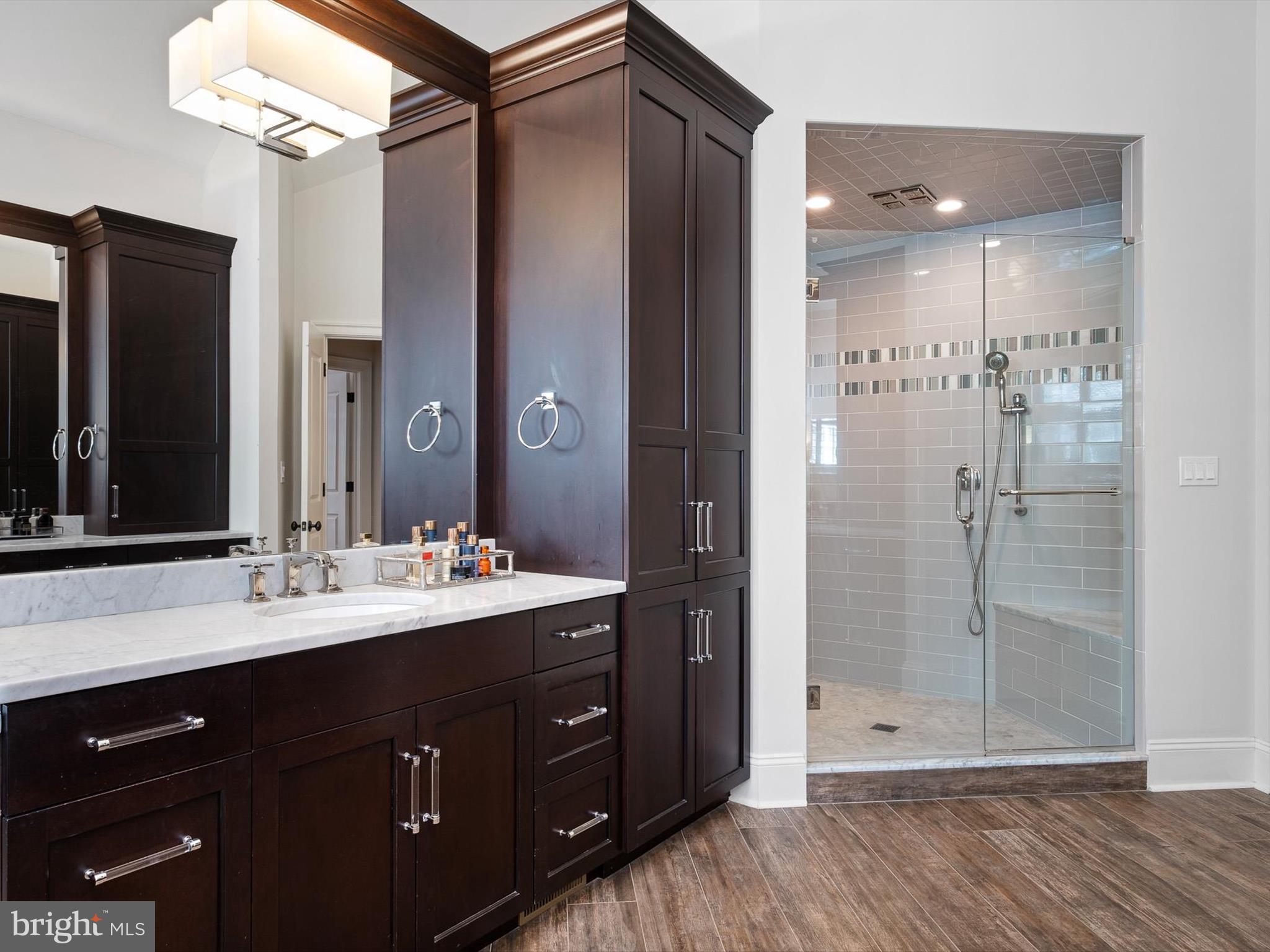 2 A Courtney Road Wilmington, DE 19807 - Photo 29 of 52 a bathroom with a double vanity sink mirror and shower