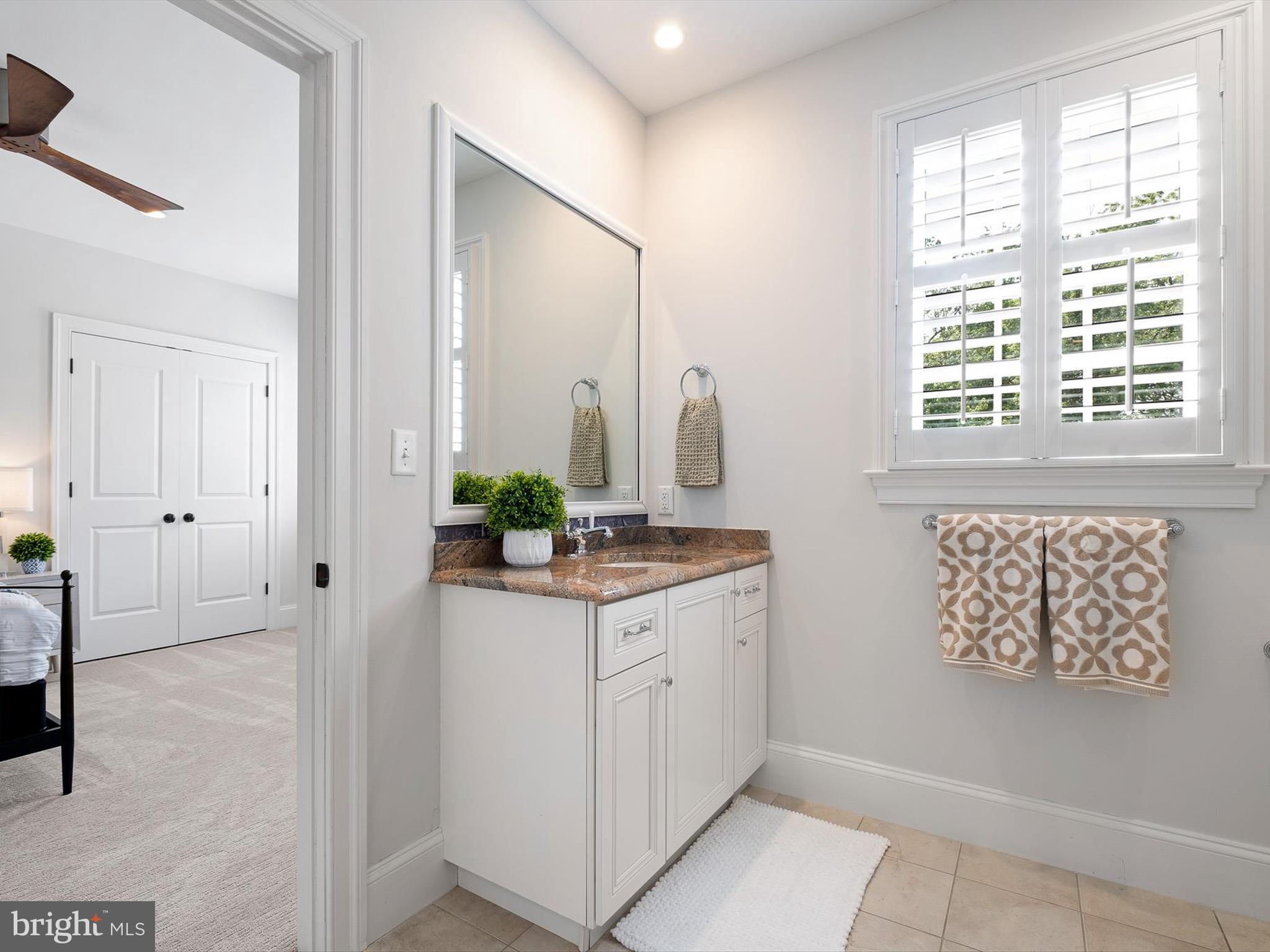 2 A Courtney Road Wilmington, DE 19807 - Photo 38 of 52 a bathroom with a granite countertop sink a mirror and a shower
