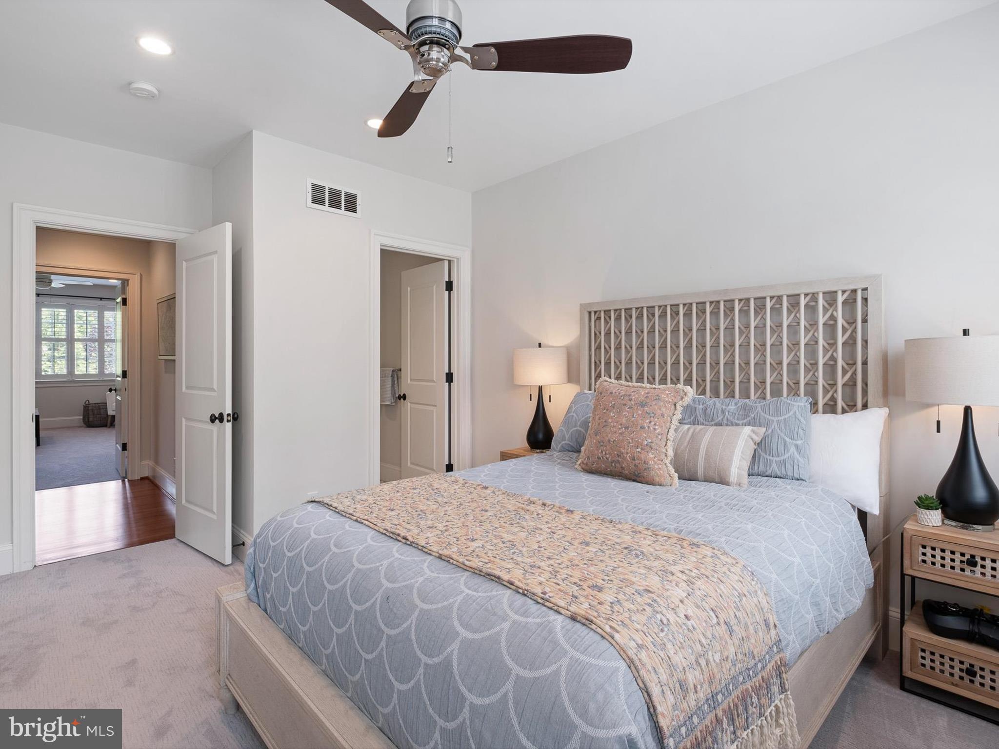 2 A Courtney Road Wilmington, DE 19807 - Photo 39 of 52 a bedroom with a large bed and a chandelier