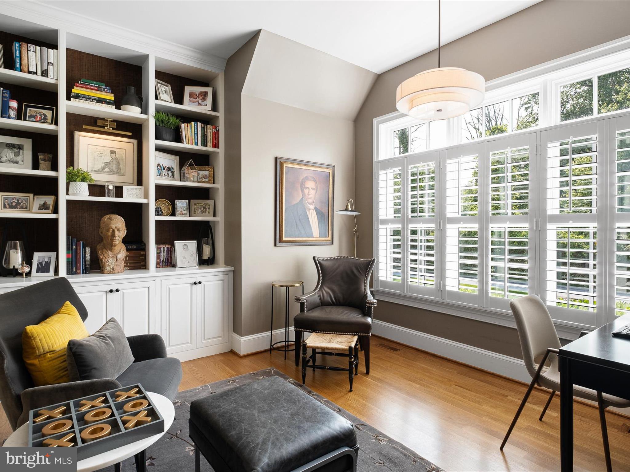 2 A Courtney Road Wilmington, DE 19807 - Photo 9 of 52 a living room with furniture hard wood floor and a book shelf
