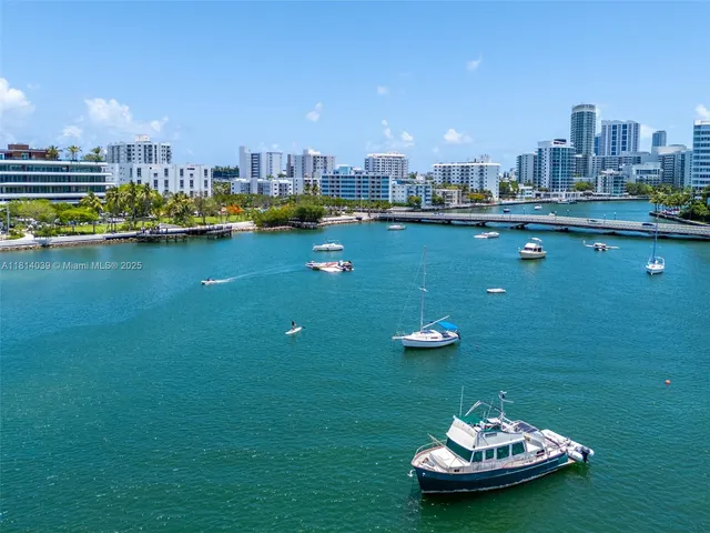 a view of a lake with a table and chairs