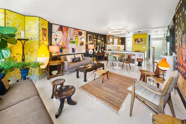 a living room with furniture and a floor to ceiling window