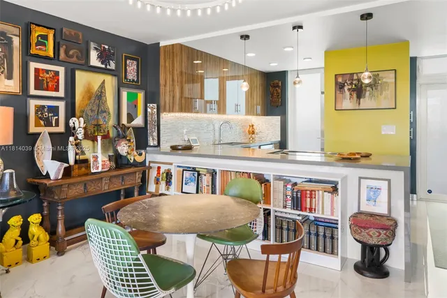 a living room filled with furniture chandelier and a wooden floor