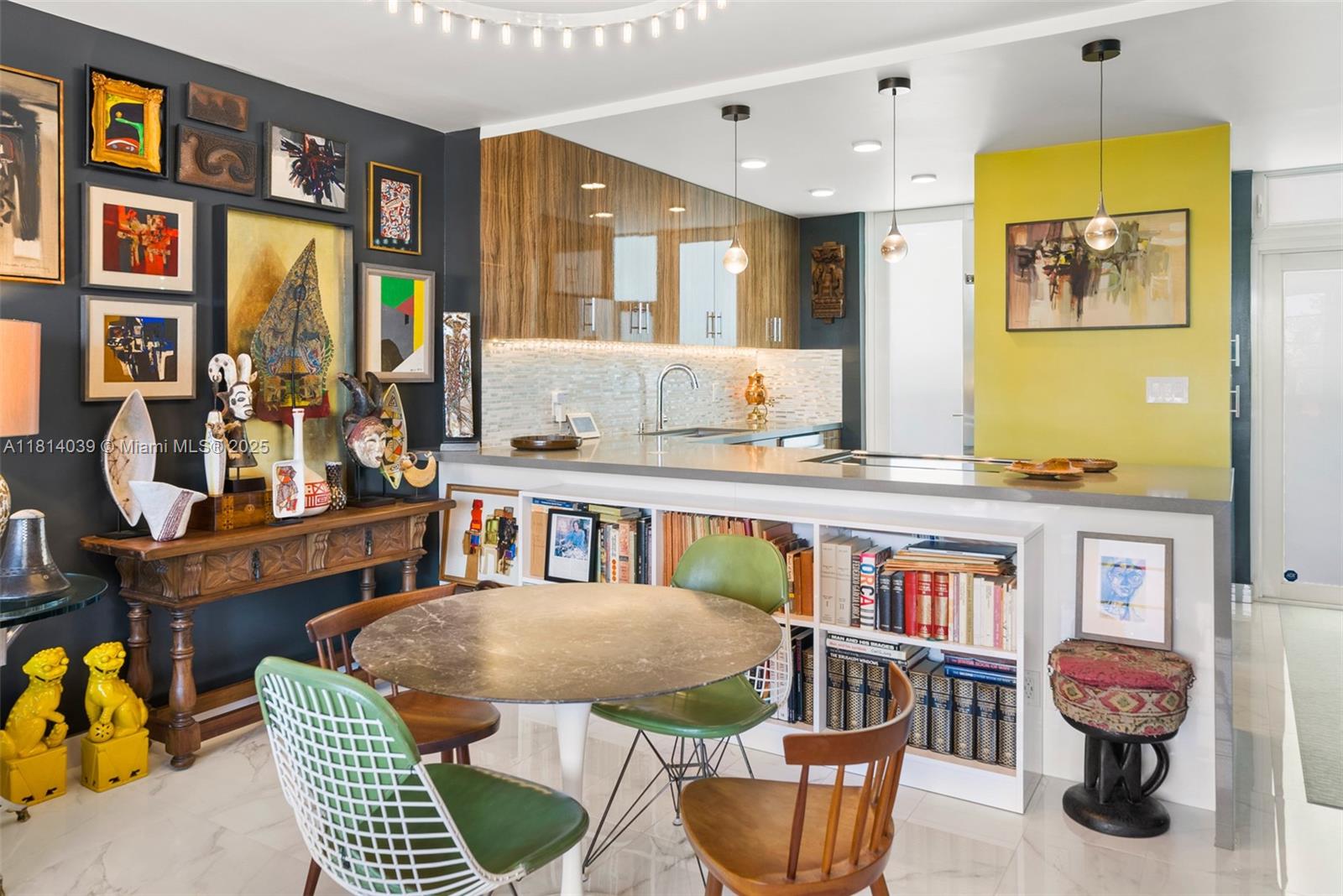 1670 Lincoln Court, Unit 2B Miami Beach, FL 33139 - Photo 8 of 24 a living room filled with furniture chandelier and a wooden floor