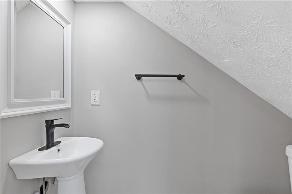 1164 Red Oak Cove Tucker, GA 30084 - Photo 12 of 24 a bathroom with a sink and a mirror