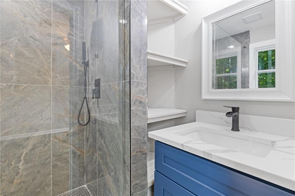 1164 Red Oak Cove Tucker, GA 30084 - Photo 19 of 24 a bathroom with a sink and a mirror