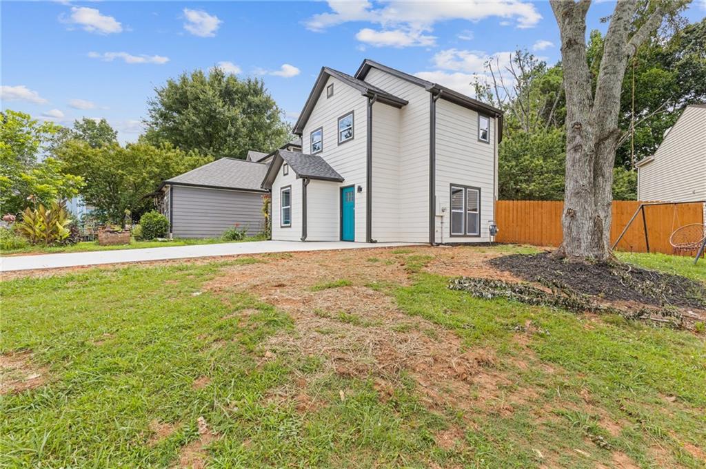 1164 Red Oak Cove Tucker, GA 30084 - Photo 2 of 24 a front view of a house with yard