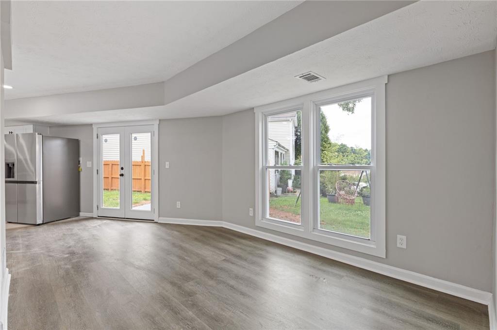 1164 Red Oak Cove Tucker, GA 30084 - Photo 4 of 24 a view of an empty room with a window