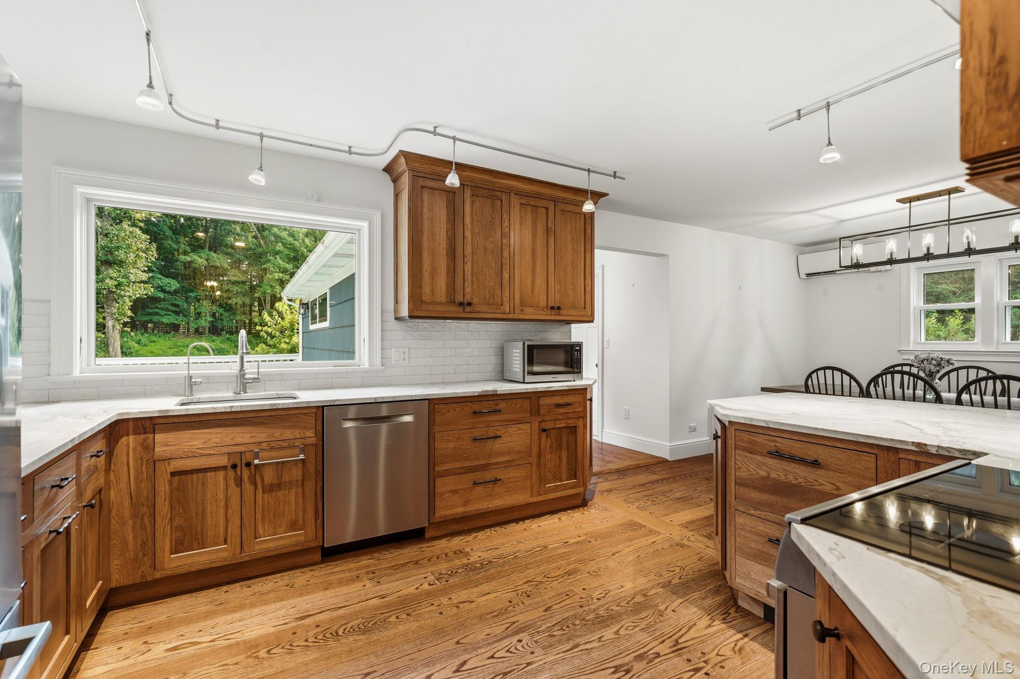 119 Mustato Road Katonah, NY 10536 - Photo 7 of 31 Country Kitchen with stainless appliances open to dining area