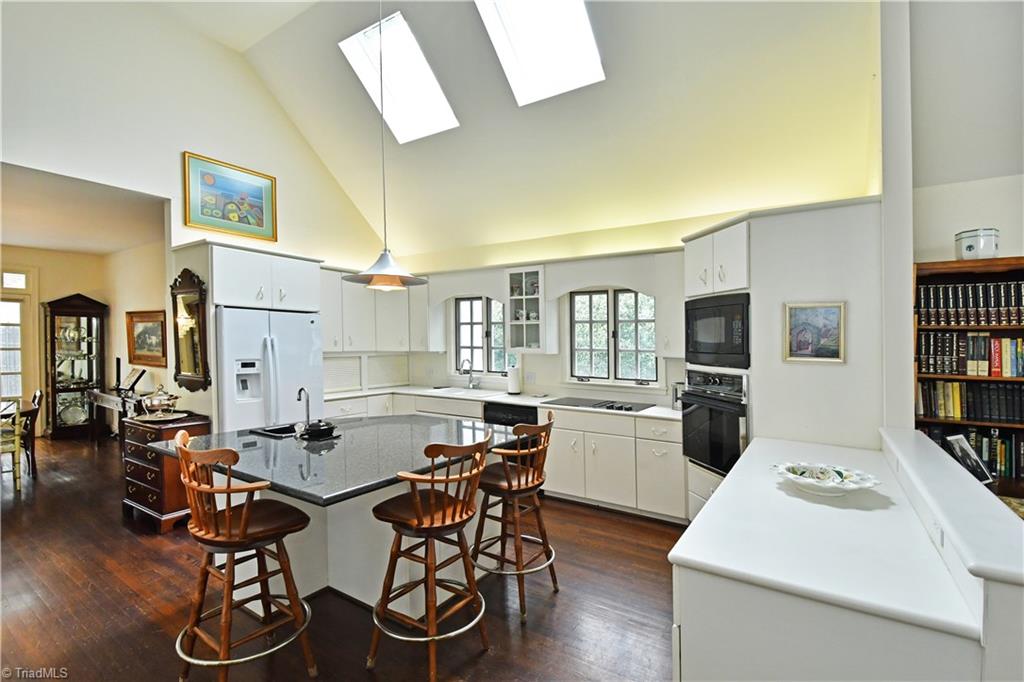 1930 Virginia Road Winston-Salem, NC 27104 - Photo 7 of 30 Sunny kitchen with seating at island