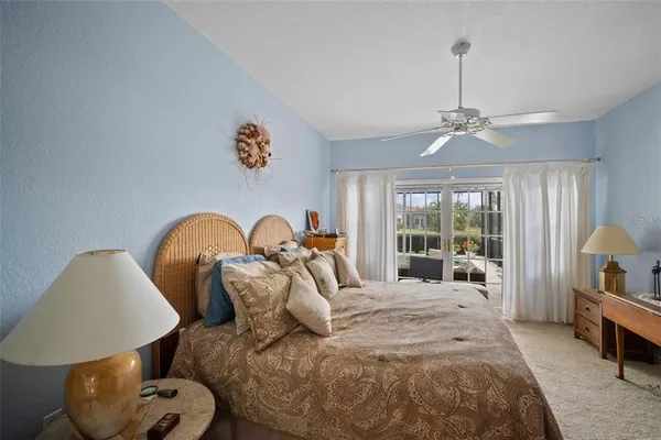 a bed room with a bed and a chandelier