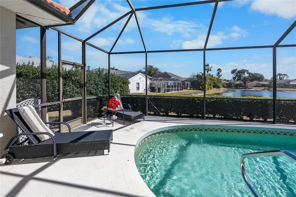 a view of a swimming pool with a porch