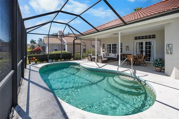 a view of a backyard with sitting area