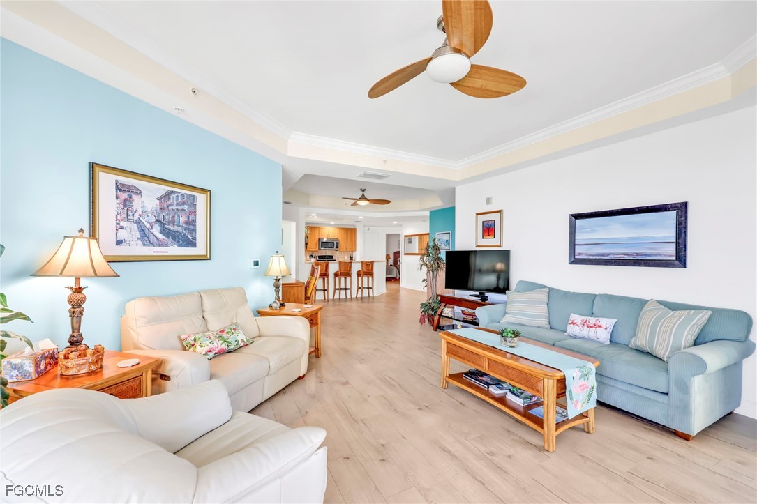 2743 First Street, Unit 1206 Fort Myers, FL 33916 - Photo 13 of 50 a living room with furniture and a flat screen tv